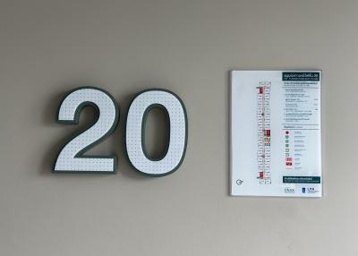 Interior wall with decorative number 20 and an energy efficiency rating chart