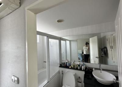 Modern spacious bathroom interior with a large mirror