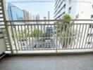 Spacious balcony with city view and tiled floor