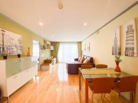 Bright and spacious living room with dining area