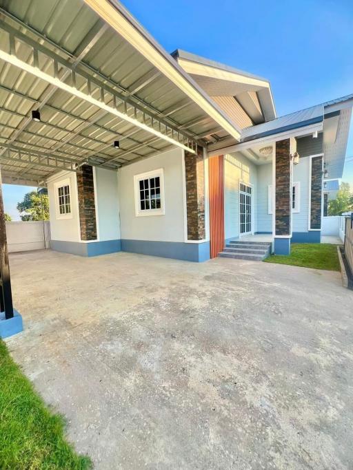 Bright and Spacious House Exterior with Covered Parking Area