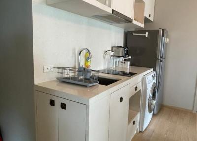 Modern kitchen with white cabinetry and appliances