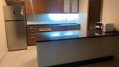 Modern kitchen with stainless steel appliances and wooden cabinets