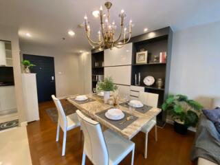 Elegant dining area with chandelier and modern furnishings