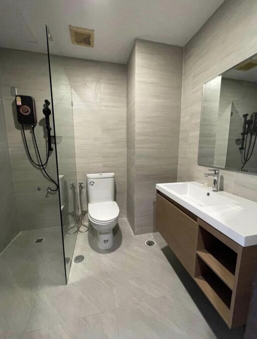 Modern bathroom with walk-in shower and wooden vanity