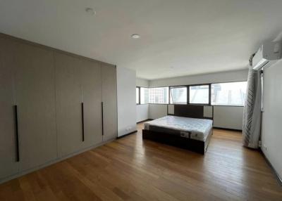 Spacious master bedroom with ample natural light and built-in wardrobes
