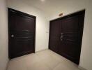 Spacious entrance hall with two wooden doors