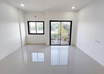 Spacious and bright empty living room with large window
