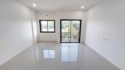 Spacious and bright empty living room with large window