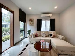 Modern living room with large windows and elegant decor