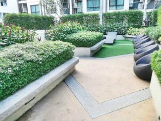 Modern common area in a residential property with landscaping and seating