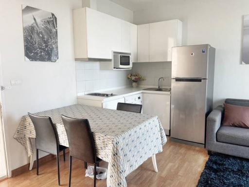 Modern kitchen with dining area and adjacent living space