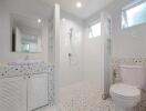 Modern bathroom with white interior design and terrazzo flooring