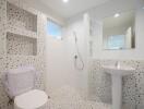 Modern bathroom with terrazzo tiles and white fixtures