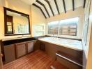 Spacious bathroom with large tub and wooden accents