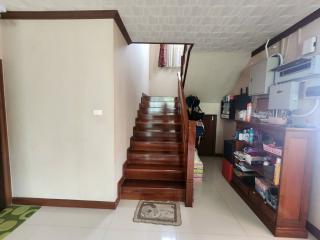 Interior view of a home with staircase and kitchenette