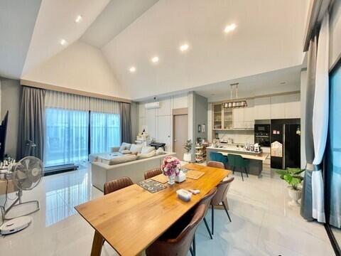 Modern open-plan living, dining and kitchen space with tasteful decor