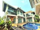 Modern two-story house with pool and balcony