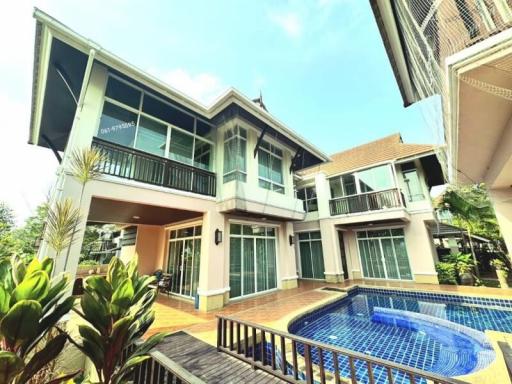 Modern two-story house with pool and balcony