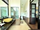 Modern bathroom with dual sinks and glass shower partition