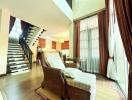 Elegant living room with staircase and high ceiling