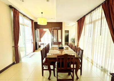 Spacious dining room with large windows and ample natural light