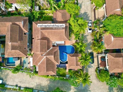 Aerial view of a residential property with pool