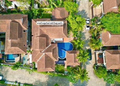 Aerial view of a residential property with pool