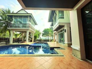 Private swimming pool with adjacent house and terrace