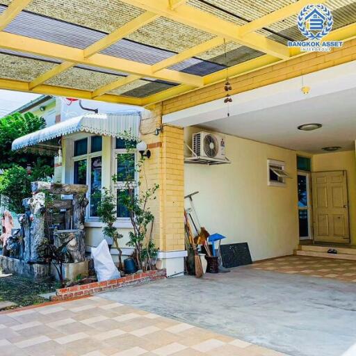 Cozy entrance area of a house with tiled flooring and decorative plants