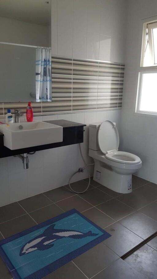 Modern bathroom interior with toilet and basin