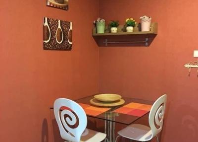 Cozy dining area with terracotta walls and modern table