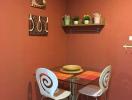 Cozy dining area with terracotta walls and modern table