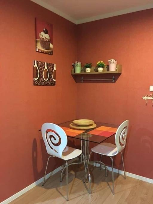 Cozy dining area with terracotta walls and modern table