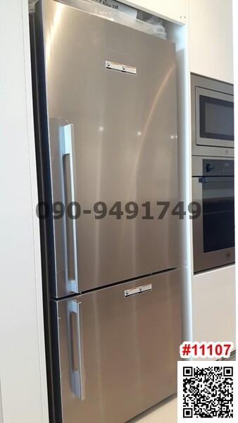 Modern stainless steel refrigerator in kitchen setting