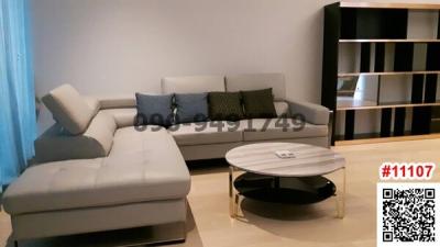 Modern living room interior with comfortable sofa and stylish shelving unit