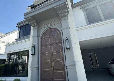 Elegant entrance of a modern residential building with a grand front door