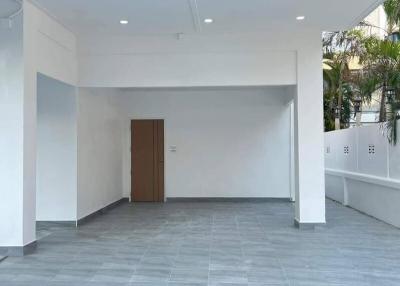 Spacious empty building interior with tiled flooring