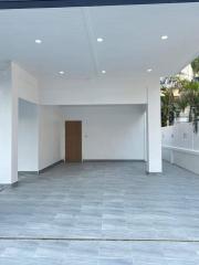 Spacious empty building interior with tiled flooring