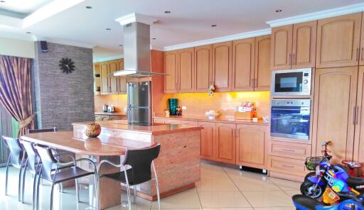 Spacious modern kitchen with central island and integrated appliances