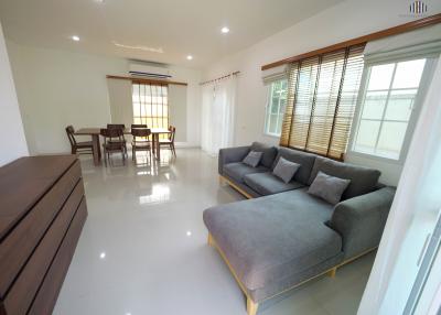 Spacious living room with comfortable seating and natural light