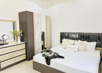 Cozy modern bedroom with comfortable bedding and elegant decor