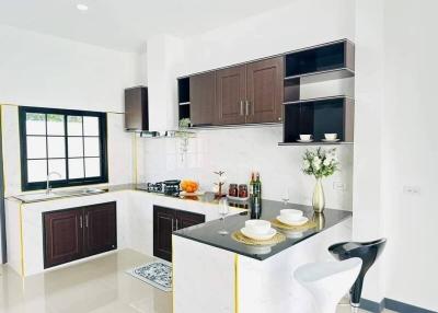 Modern Kitchen with White Interior and Dark Cabinets