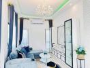 Elegant living room with modern furniture and chandelier
