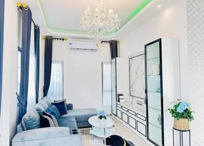 Elegant living room with modern furniture and chandelier