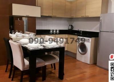 Modern kitchen with dining area and appliances