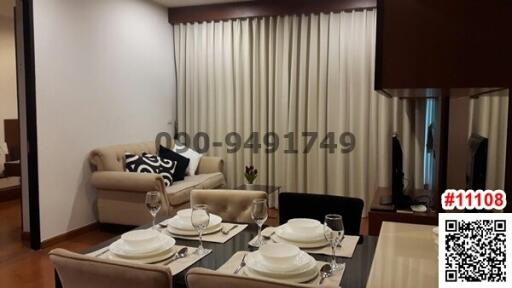 Elegant dining room with a set table, contemporary furniture and a comfortable sitting area