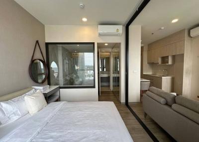 Modern bedroom with en suite bathroom and integrated living area