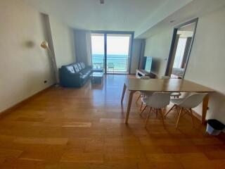 Spacious living room with hardwood floors and ocean view