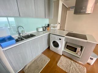 Modern kitchen with integrated appliances and sea view